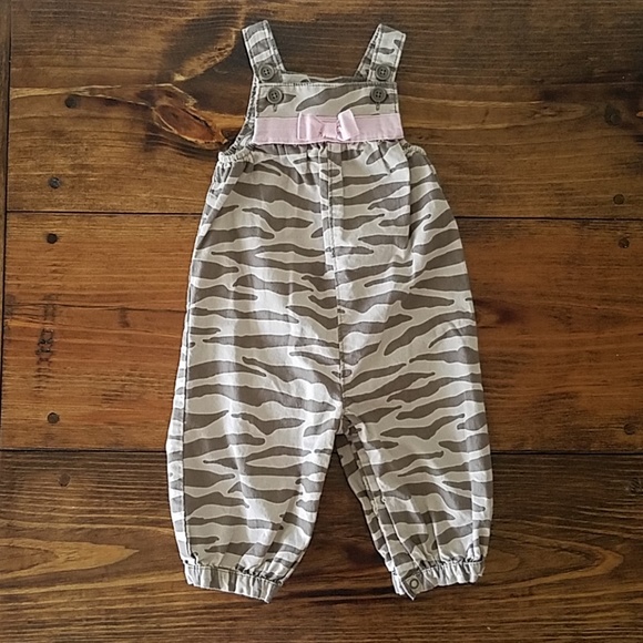 One piece tan zebra jumpsuit with pink bow - Picture 1 of 4